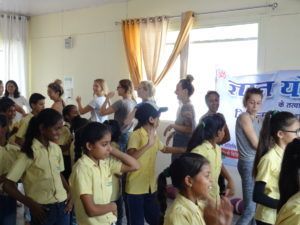 slum childrenand yoga teacher training students